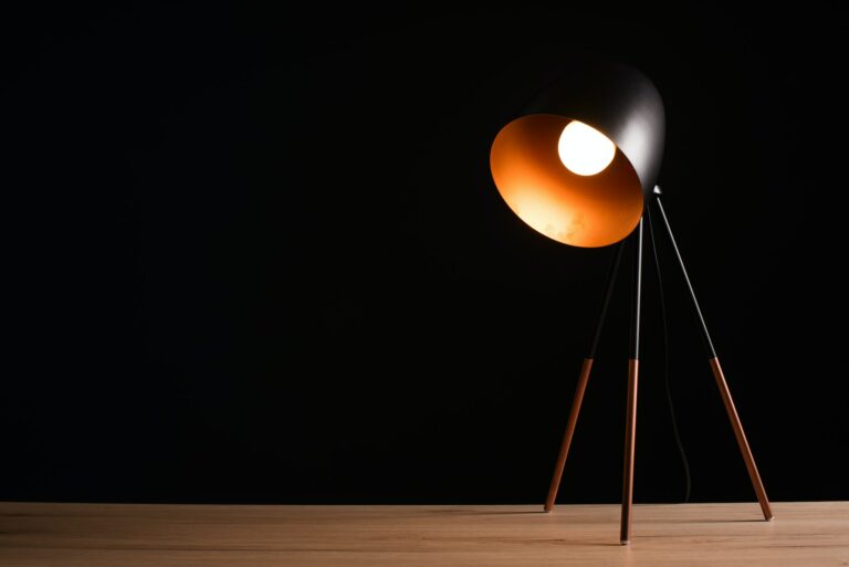 Desk lamp on empty wooden office table